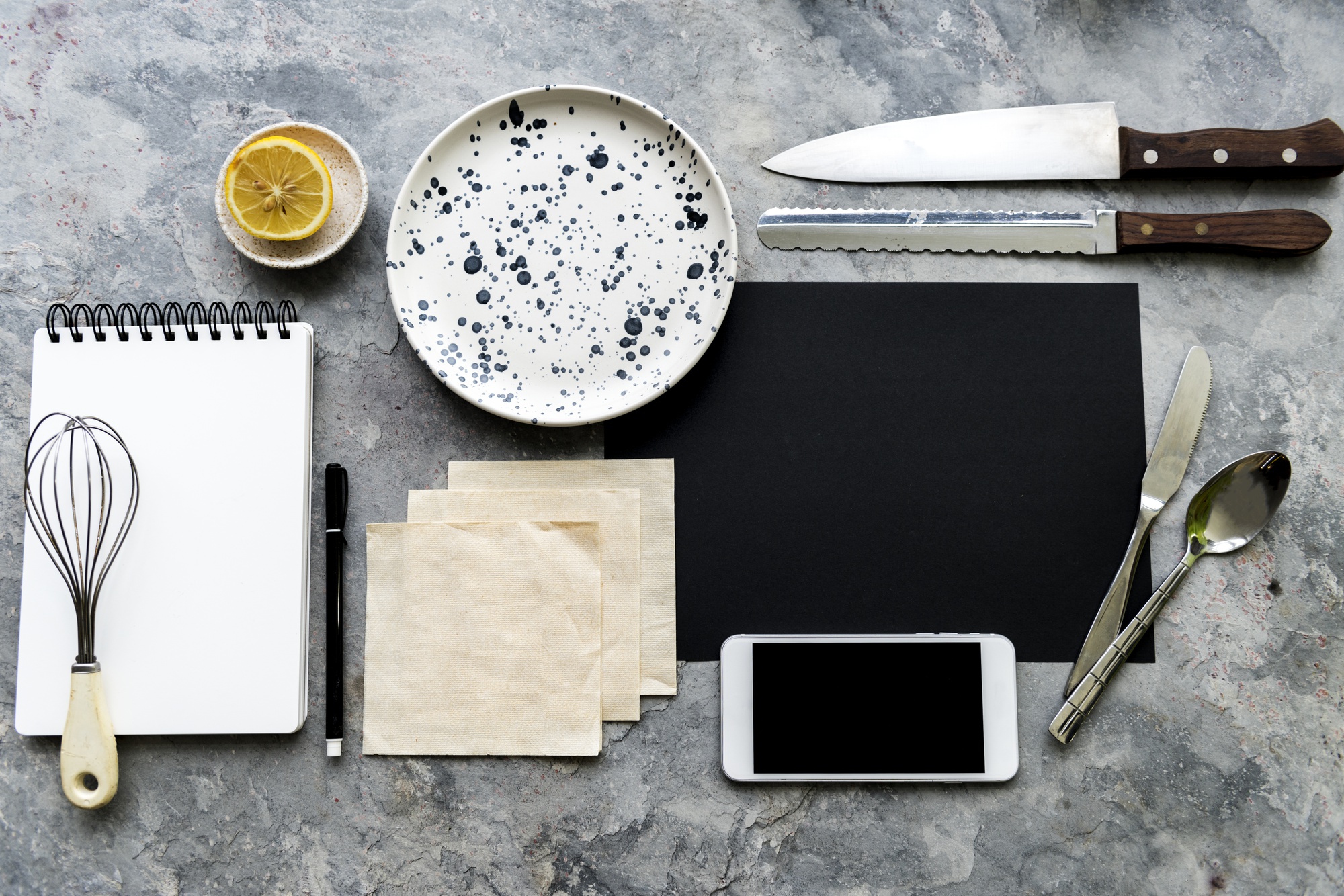 small test kitchen with plated dishes and notes
